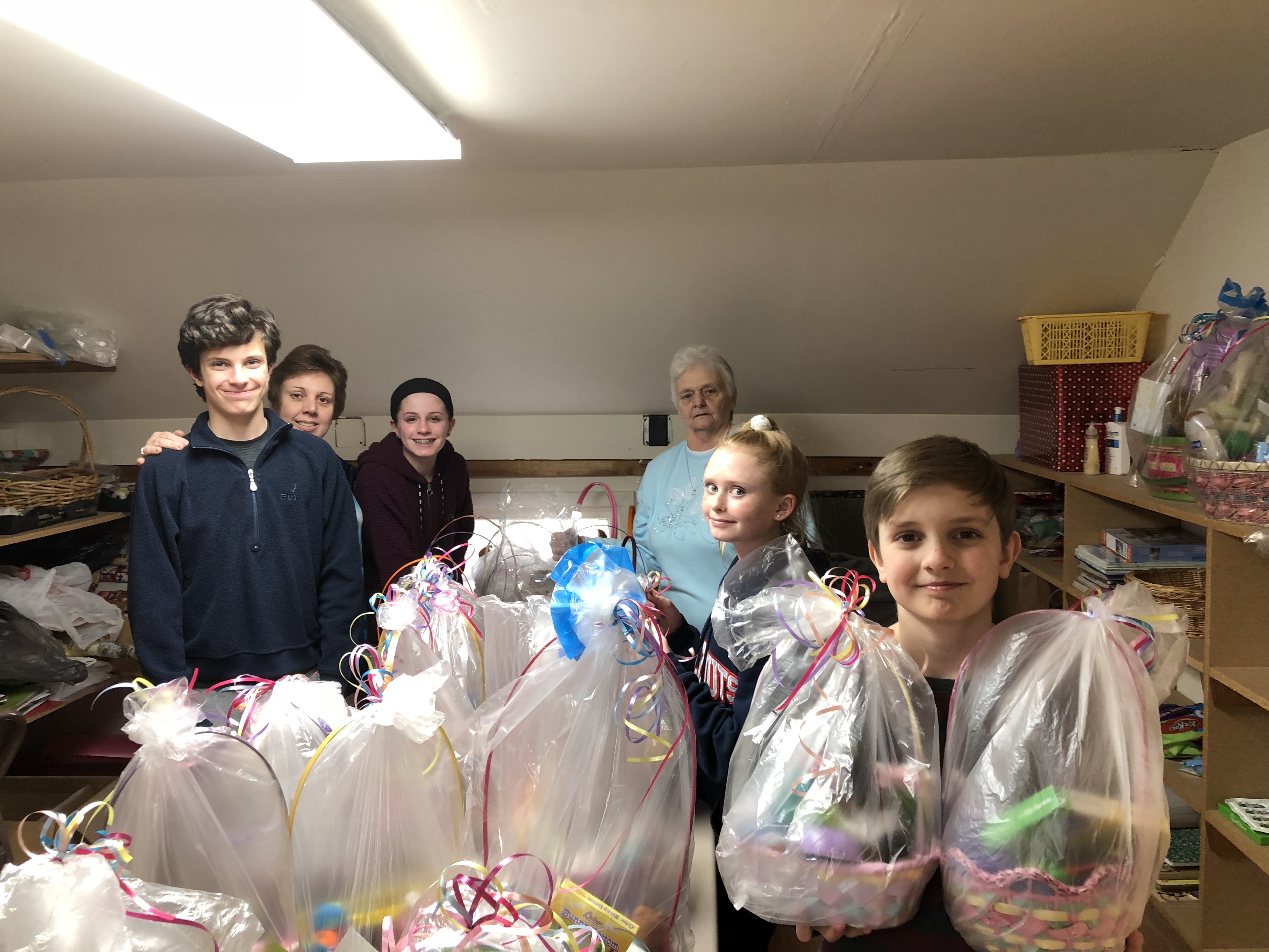 Children with donated easter baskets for food bank