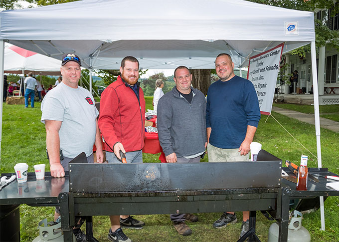 four volunteers ready to barbecue for walkers